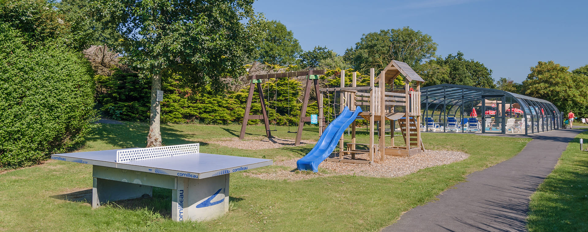 Play area and heated pool at campsite Pors Peron in Brittany 